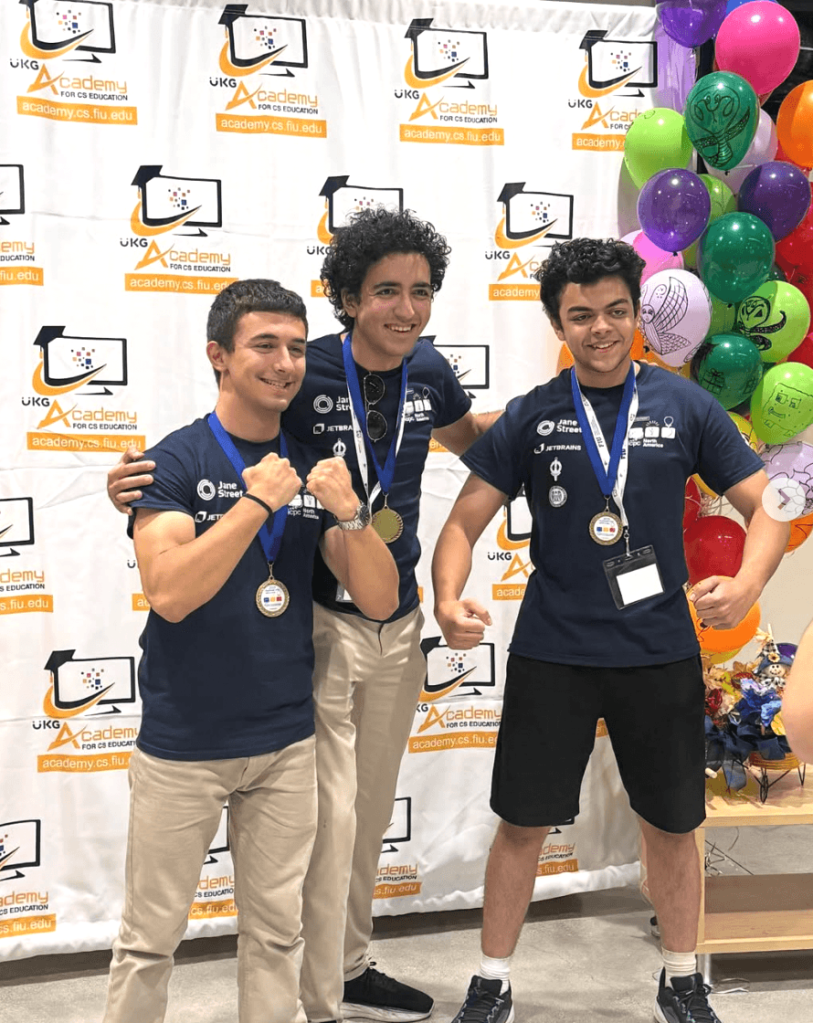 Hossam Darwish receiving an ICPC gold medal on the podium